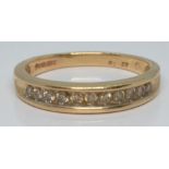 A 9ct gold half eternity ring set with diamonds, 2.4g, size L/M