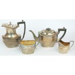 George V hallmarked silver four piece teaset with reeded lower bodies, Sheffield 1909/1910/1911