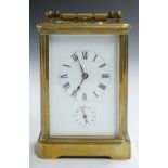 WITHDRAWN     A 19th or early 20thC brass cased repeating carriage clock, the white enamel dial with