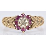 A 9ct gold ring set with a diamond and a rubies, 2.9g, size P/Q