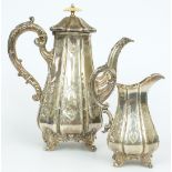 Victorian hallmarked silver ornate coffee pot and milk jug of lobed form, raised on four scroll