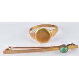 An 18ct gold signet ring (3.1g) and a 9ct gold brooch set with a turquoise cabochon (1.7g)