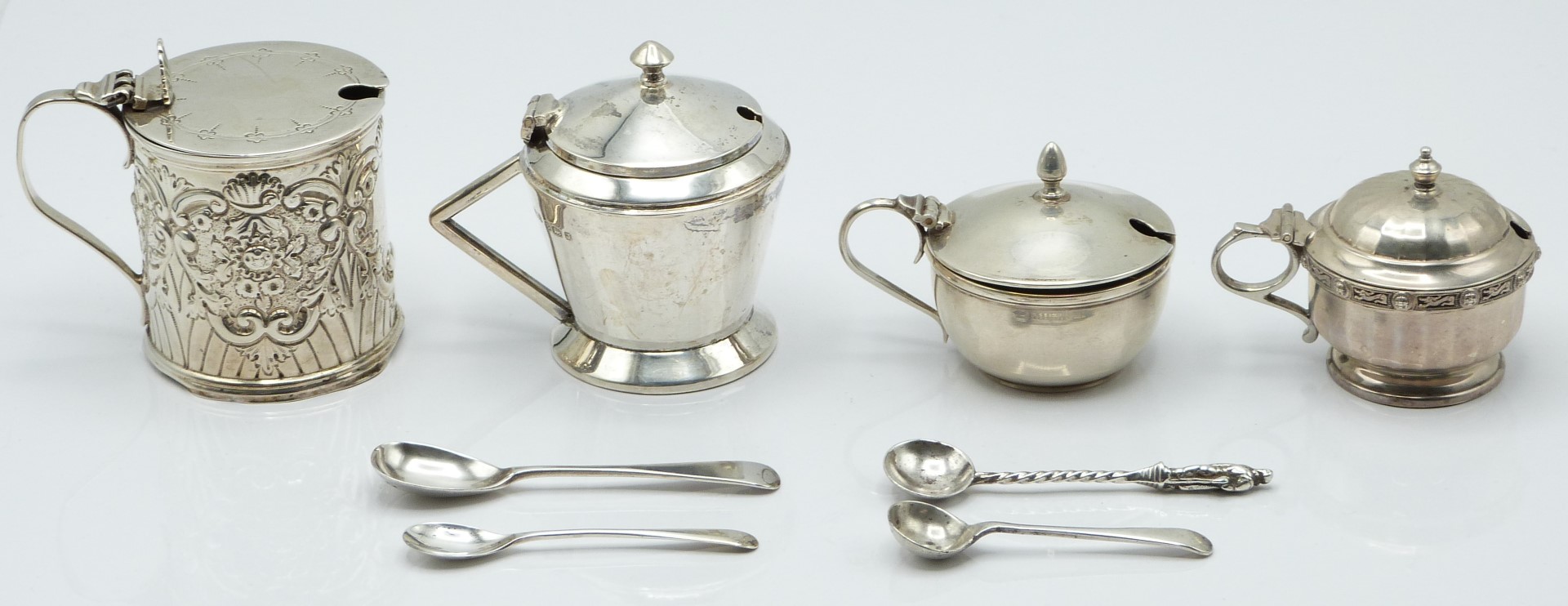 Four various Victorian and later hallmarked silver mustards, London 1898, Birmingham 1934 and 1933