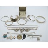 A collection of silver jewellery including five bangles, three silver lockets, necklaces, ring etc