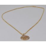 A 9ct gold Taurus pendant and chain, 3.5g