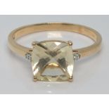 A 10k gold ring set with seranite and diamonds, size U