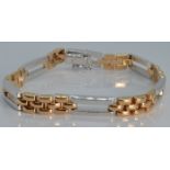 An 18ct bi-coloured gold bracelet made up of rectangular links, 17.8g