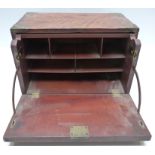 A 19thC brass-bound mahogany veneer campaign stationery box or travelling desk with secretaire