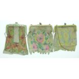 Three painted 19th/20thC chain link purses with enamel style clasps, largest 15 x 12cm