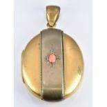 Victorian gilt locket set with a coral cabochon, 2.5 x 5cm