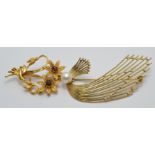 A 9ct gold foral brooch set with garnets and another 9ct gold brooch set with a pearl, 12.6g