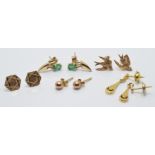 Five pairs of 9ct gold earrings including emerald set and a pair in the form of swallows, 4.5g