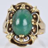 A 14k gold ring set with a turquoise cabochon, 6.2g, size N