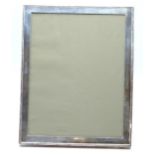 George VI hallmarked silver photograph frame to suit 9 x 7 inch photo, with easel back for either