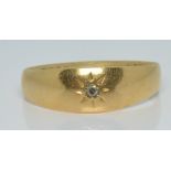 An 18ct gold ring set with a diamond in a star setting, 2.6g, size O