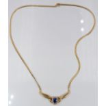 An 18ct gold necklace set with an oval cut sapphire of approximately 0.5ct and diamonds, 8.2g