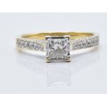 An 18ct gold ring set with a 0.7ct princess cut diamond and diamond encrusted shoulders, with GIA