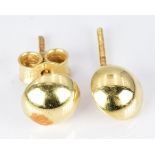 A pair of 18ct gold studs, 1g