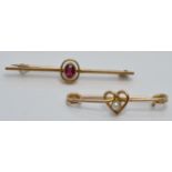 A 15ct gold brooch set with a ruby (2.4g) and a 9ct gold brooch set with a seed pearl in a heart