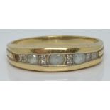 A 9ct gold ring set with aquamarines and diamonds, 2.2g, size N