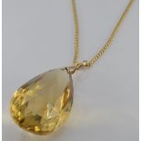 An 18ct gold necklace, 19.2g with a 9ct gold pendant set with a briolette cut citrine, 28.2g