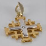 A bi-coloured gold cross pendant set with a diamond, 4.4g