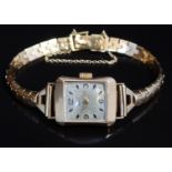 Universal Geneve 18ct gold ladies wristwatch with gold hands, Arabic numerals and hour markers,