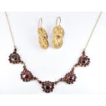 Victorian Bohemian cut garnet necklace, length 44.5cm and a pair of silver gilt filigree earrings