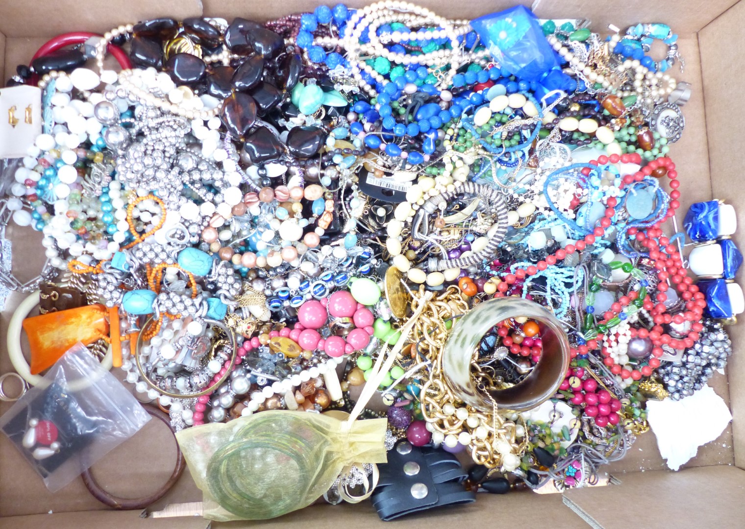 A collection of costume jewellery including vintage beads, silver rings etc