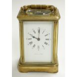 Brass carriage clock with Roman enamelled dial and Arabic minutes, marked Mappin & Webb, with