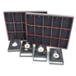 Four modern Heritage Collection pocket watches and two display racks