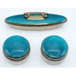 George V pair of turquoise guilloché enamel and hallmarked silver dressing table pots and matching