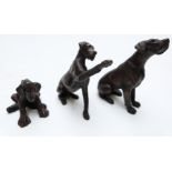 Three miniature bronze dogs or puppies, height of tallest 7.5cm