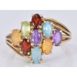 A 9ct gold ring set with topaz, garnets, citrine, peridot and amethysts, 3.6g, size N/O