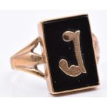 A 9ct gold ring set with onyx and a gold letter J, 3.8g, size T