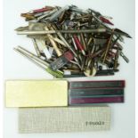 A collection of pens, propelling pencils, parts and accessories including yellow metal and
