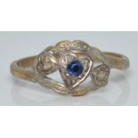 A 9ct gold ring set with a sapphire and two diamonds in a heart setting, 1.9g, size M