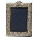 Hallmarked silver photograph frame to suit 6 x 4 inch photo, with embossed decoration and easel