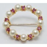 A 9ct gold brooch set with pearls and rubies, diameter 2cm, 3.2g