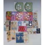 A quantity of coins in presentation packs to include £2, £1, pre-decimal, old penny sets, 50