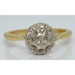 An 18ct gold ring set with diamonds in a cluster, 3.7g, size M