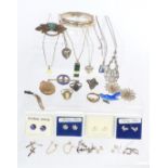 A collection of silver jewellery including brooches, earrings, etc.