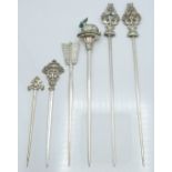 Pair of French white metal meat skewers, the ornate finials modelled as sea creatures, both with