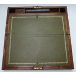 A 19thC brass inlaid mahogany writing slope with tooled leather writing slope, full length drawer