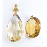 Two Edwardian pendants each set with a large citrine