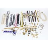 A collection of costume jewellery including beads, watches etc