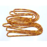 Baltic amber necklace made up of oval beads, 85g