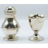 Modern hallmarked silver pepper, London 1979 maker C J Vander Ltd, height 9cm, together with an