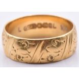 An 18ct gold wedding band/ ring with engraved floral decoration, 4.3g, size K