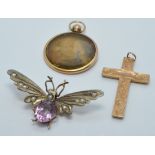 A c1900 silver gilt pin in the form of a butterfly set with amethyst and seed pearls and a 9ct